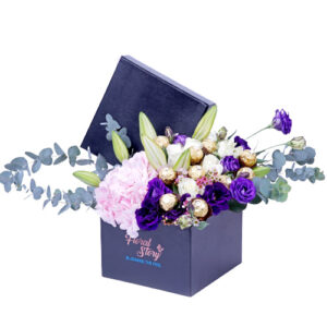 flowers in box with chocolate