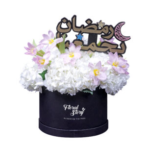 white hydrangea flowers in black box with tulip