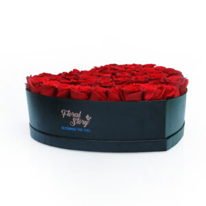 red roses in heart box